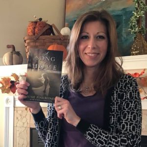 A Song of Home by Susie Finkbeiner (Pearl Allard holding book)