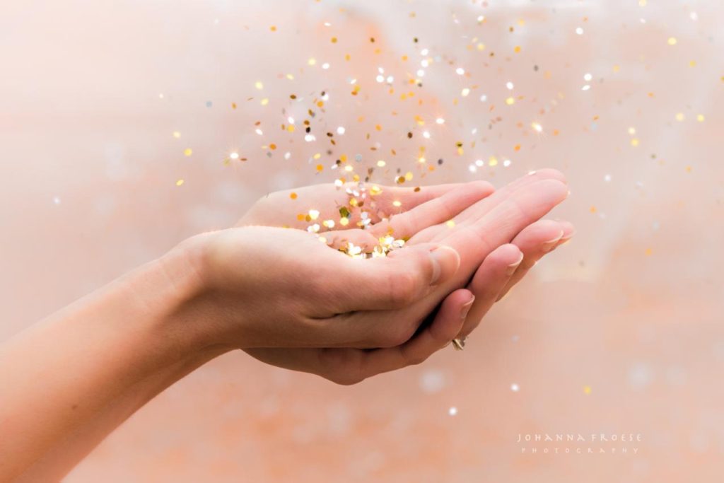 Pearl Allard holding glitter Photo Credit: Johanna Froese Photography